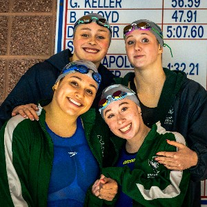 Swimmers, smiling with medals